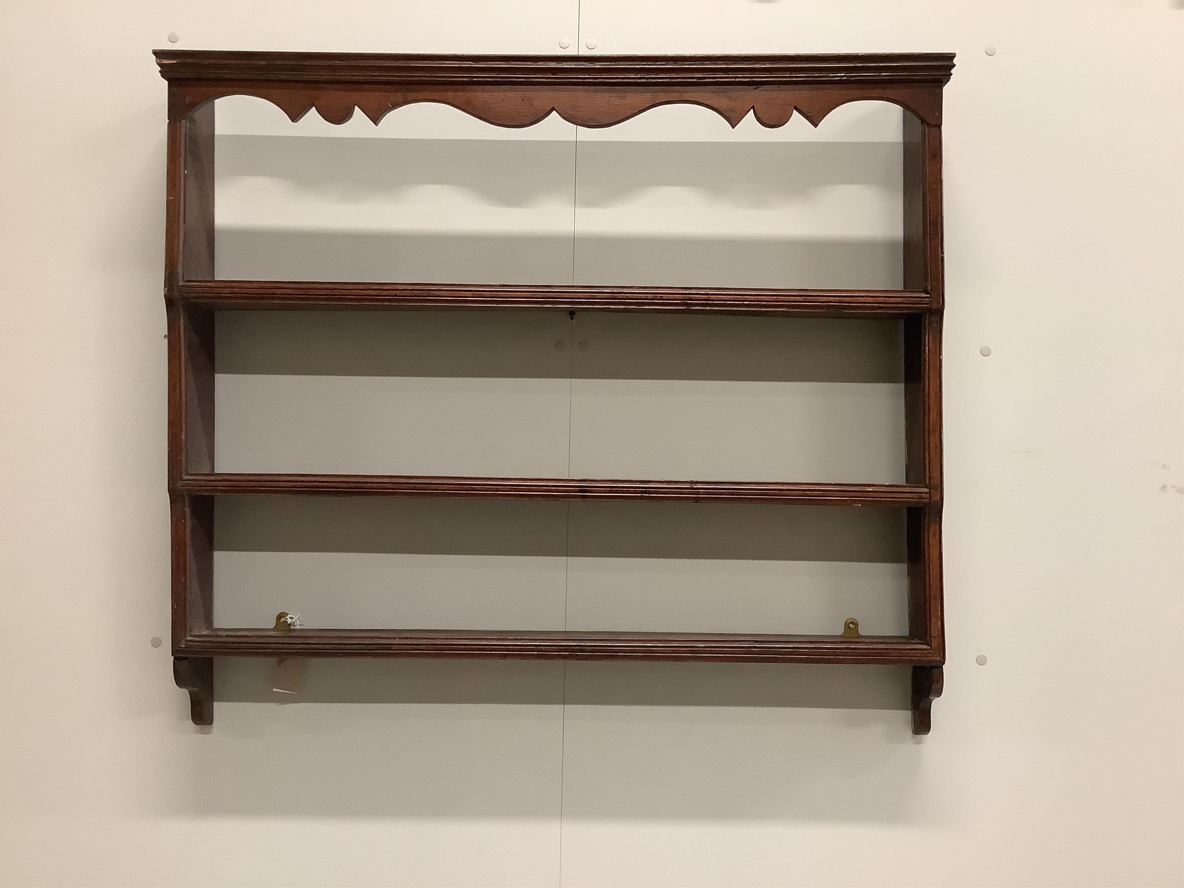 A small 18th century oak plate rack, width 103cm, height 90cm. Condition - fair